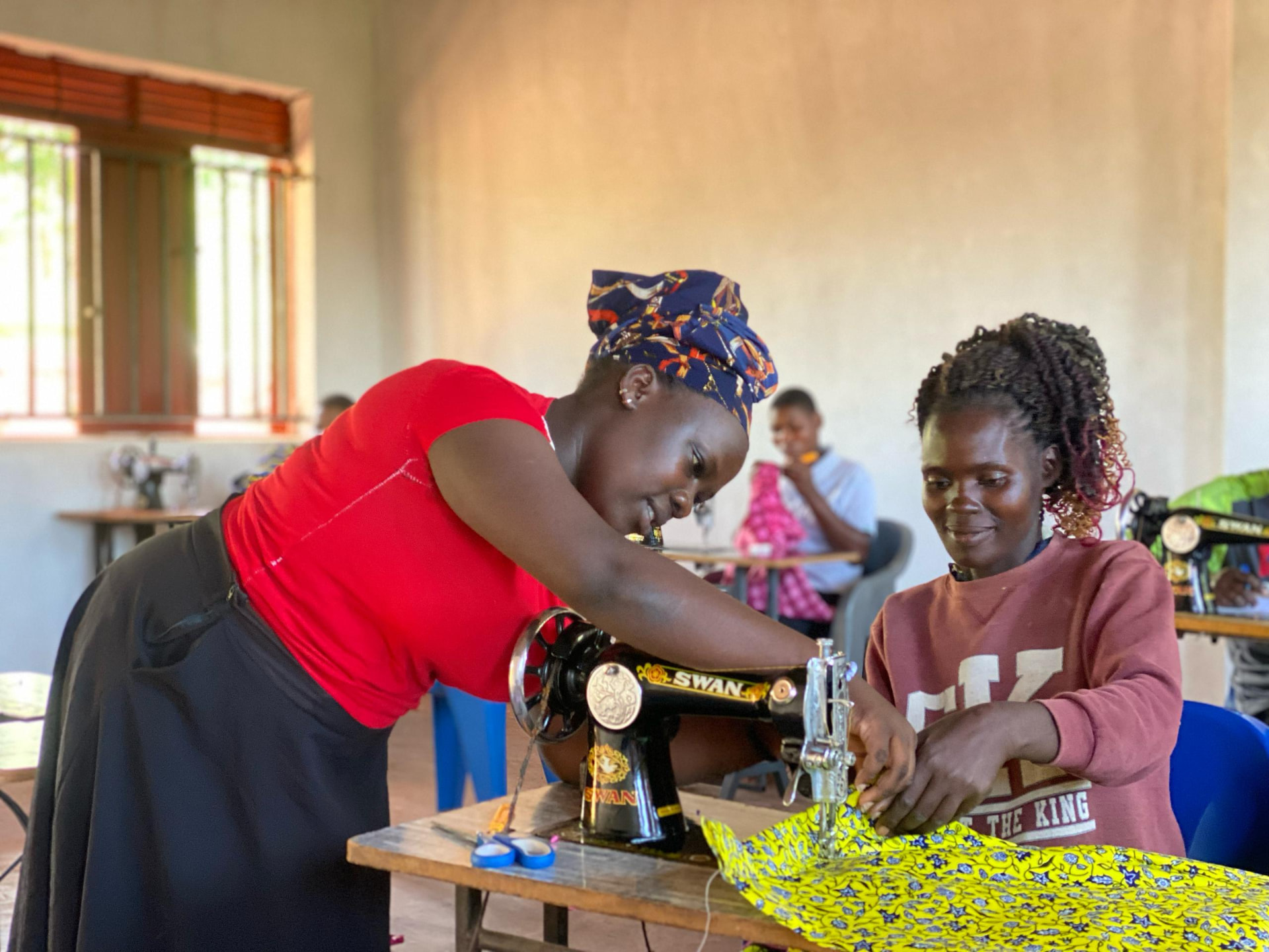 Hands-on tailoring instruction at the workshop